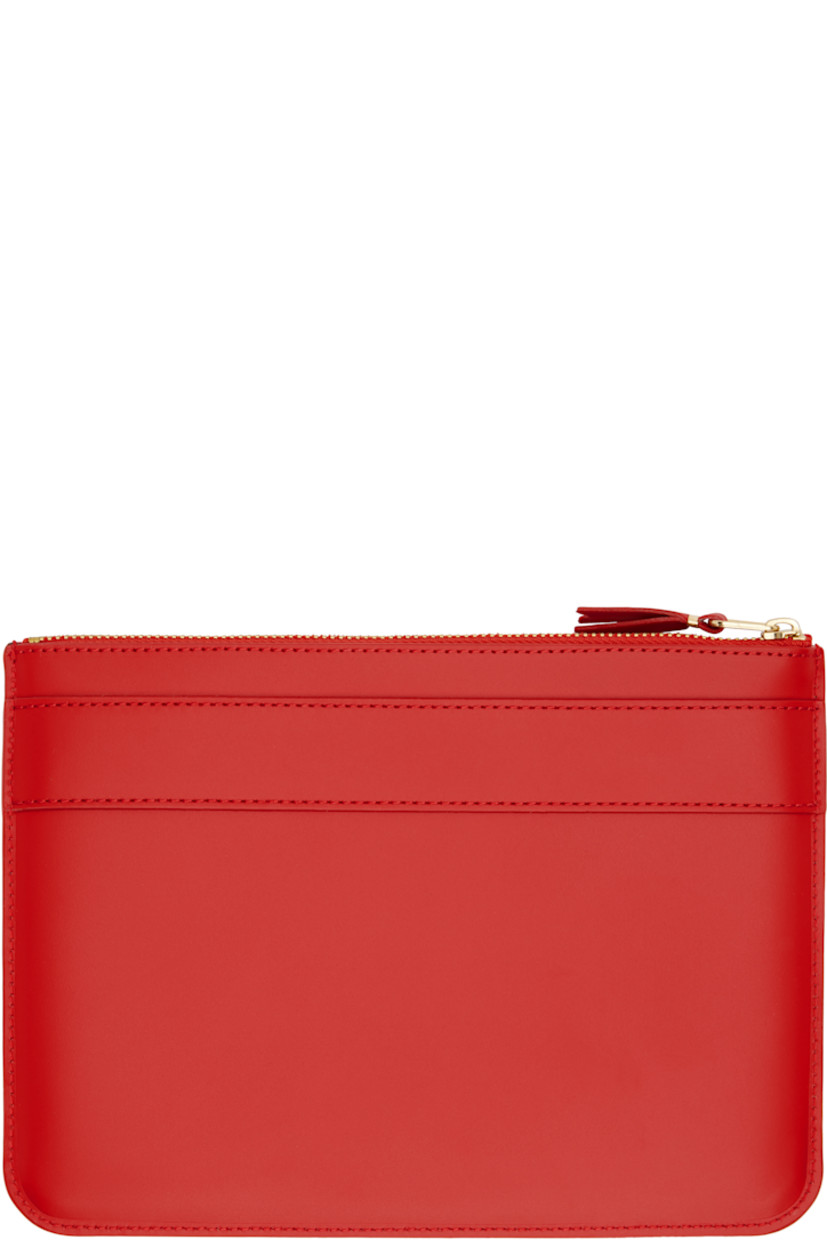 Buffed leather pouch in red.

· Bow accent and logo stamp at face
· Zip closure
· Grained leather lining
· Logo-engraved gold-tone hardware
· H6.5" x W8.75"

Supplier color: Red