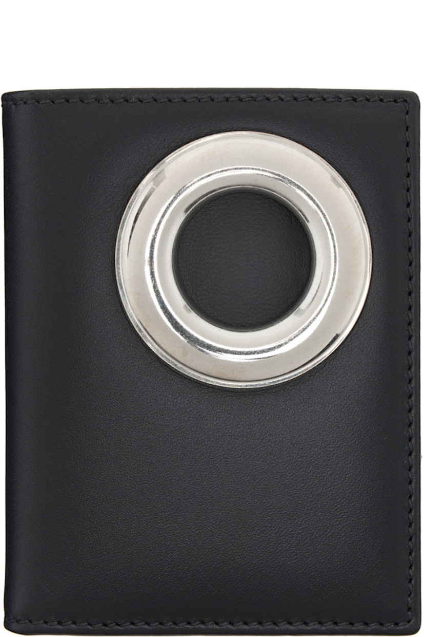 Buffed leather bifold wallet. 

· Eyelet at face
· Six card slots at interior 
· One note slot 
· H4" x W3" x D0.75"

Supplier color: Black