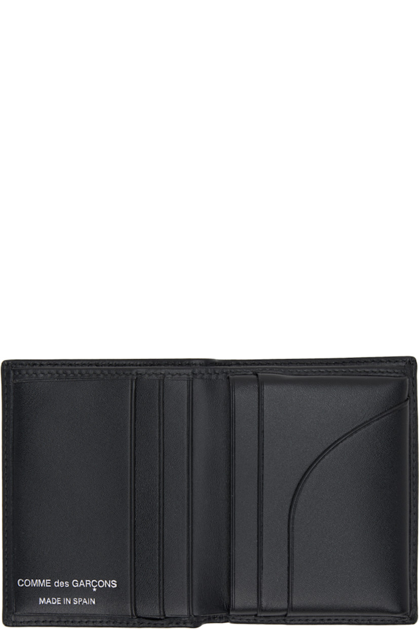 Buffed leather bifold wallet. 

· Eyelet at face
· Six card slots at interior 
· One note slot 
· H4" x W3" x D0.75"

Supplier color: Black
