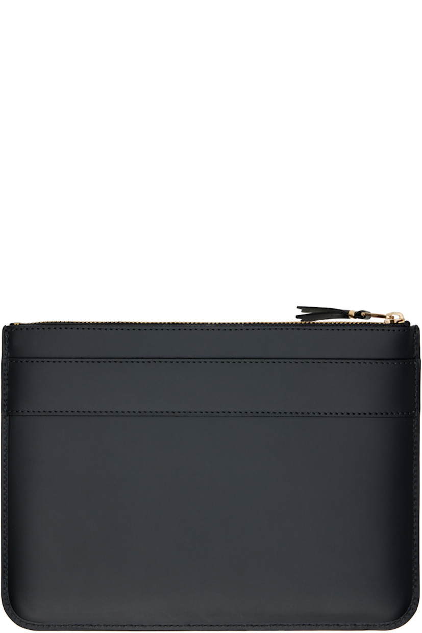 Buffed leather wallet.

· Bow accent and logo stamp at face
· Zip closure
· Grained leather lining 
· H6.5" x W9"

Supplier color: Black