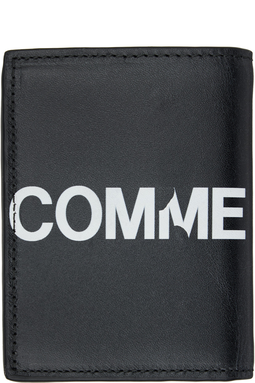 Buffed leather bifold wallet.

· Logo printed throughout
· Six card slots at interior 
· One note slot 
· H4" x W3" x D0.5"

Supplier color: Black