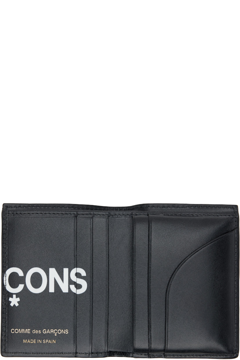 Buffed leather bifold wallet.

· Logo printed throughout
· Six card slots at interior 
· One note slot 
· H4" x W3" x D0.5"

Supplier color: Black