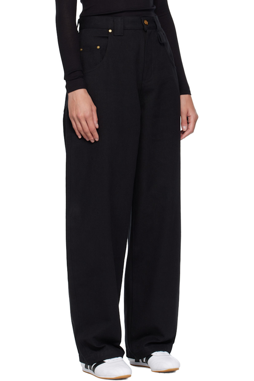 Tapered non-stretch denim jeans.

· High-rise
· Belt loops
· Five-pocket styling
· Zip fly
· Leather logo patch at back waistband
· Logo patch at back pocket
· Logo-engraved antiqued gold-tone hardware

Supplier color: Black denim