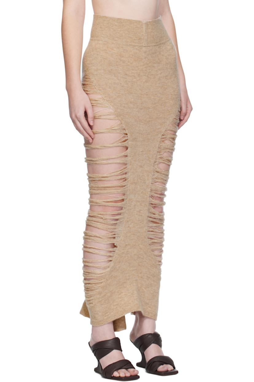 Knit stretch alpaca-blend midi skirt.

· Laddering throughout
· Rib-knit waistband
· Ruffled droptail hem

Supplier color: Dna dust