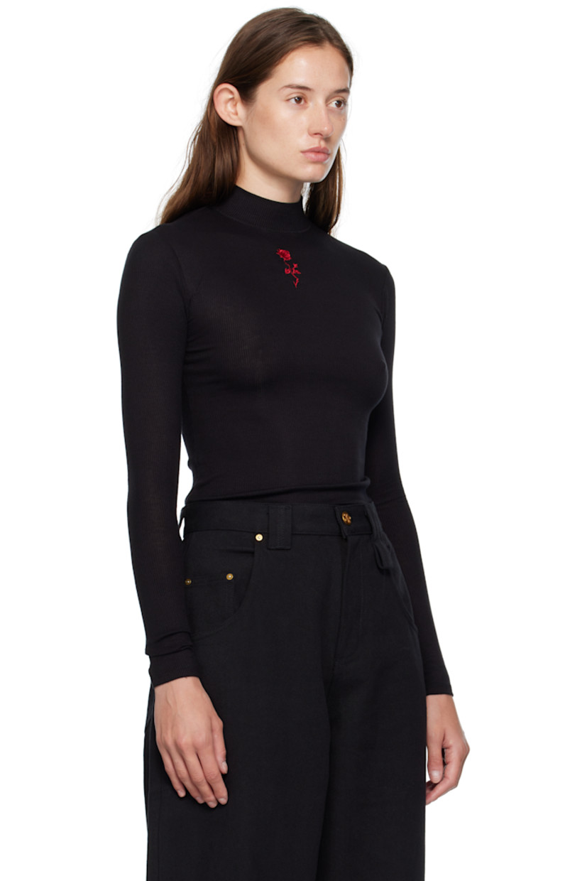 Stretch ribbed jersey top.

· Mock neck
· Graphic embroidered at chest

Supplier color: Black