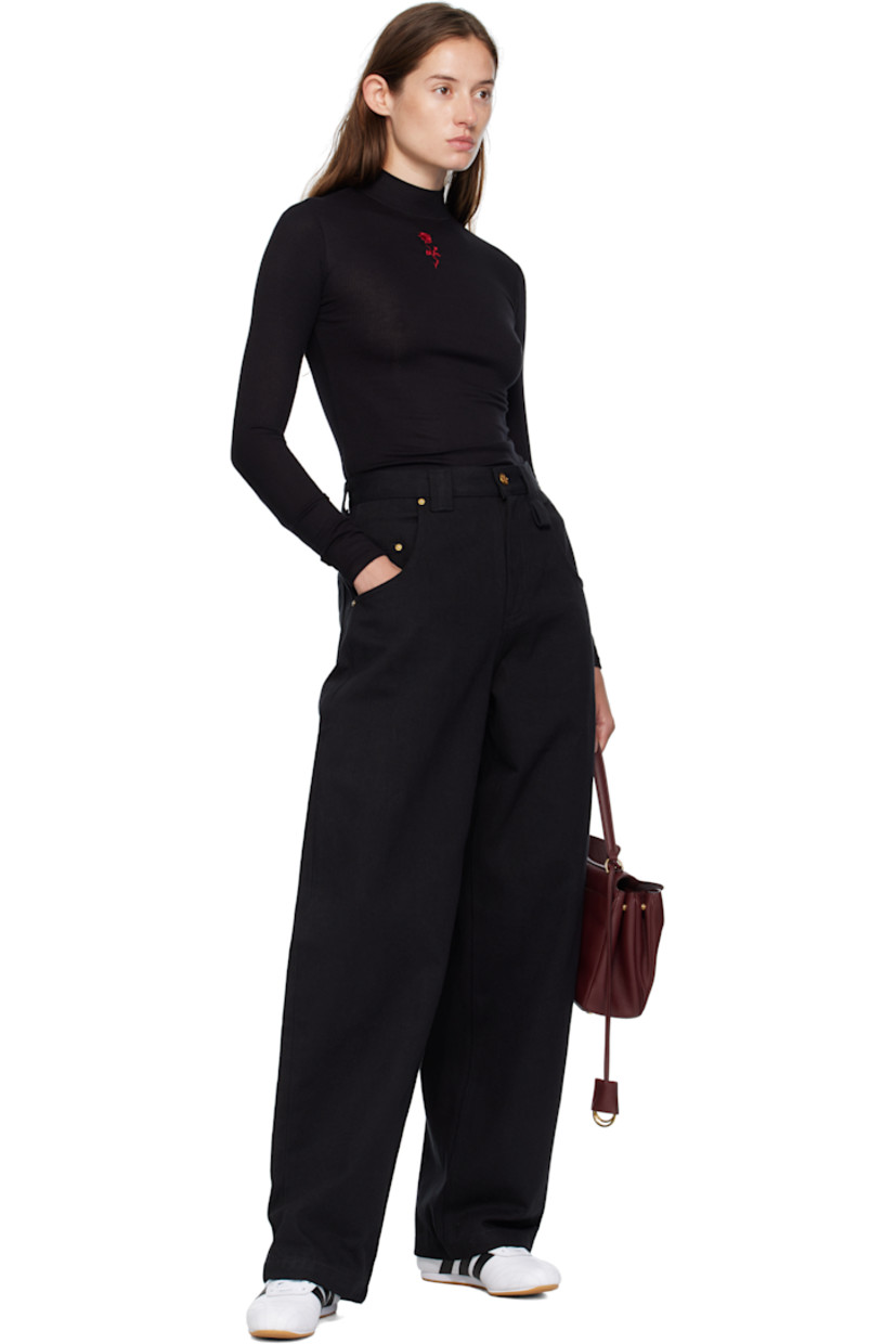 Stretch ribbed jersey top.

· Mock neck
· Graphic embroidered at chest

Supplier color: Black