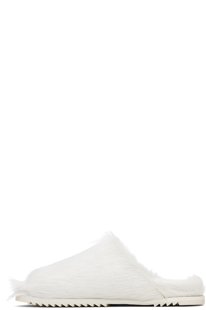 Hair-on leather slip-on sandals.

· Open toe
· Treaded rubber sole

Supplier color: Milk