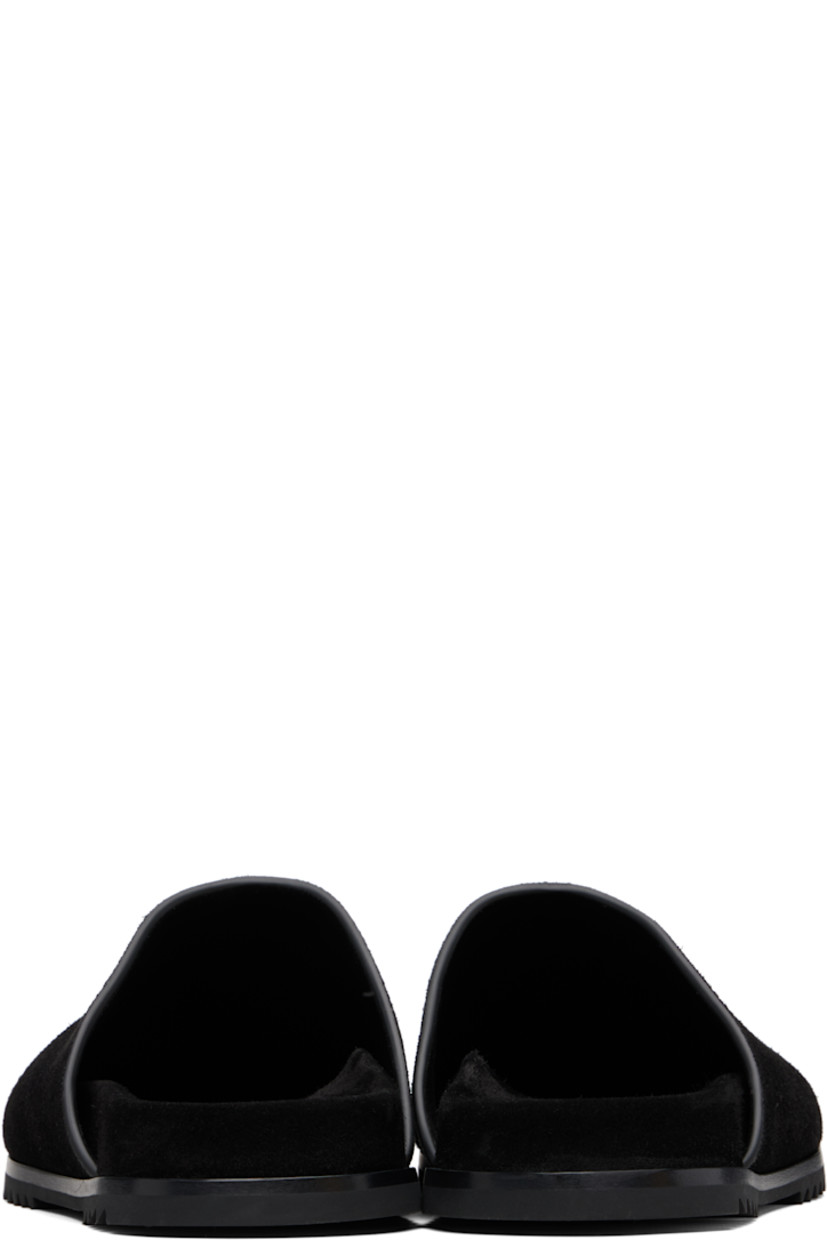 Suede slip-on loafers.

· Logo embossed at molded footbed
· Treaded rubber sole

Supplier color: Black