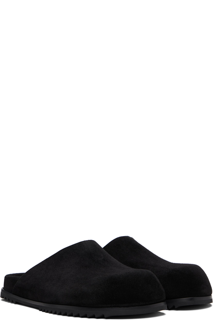 Suede slip-on loafers.

· Logo embossed at molded footbed
· Treaded rubber sole

Supplier color: Black