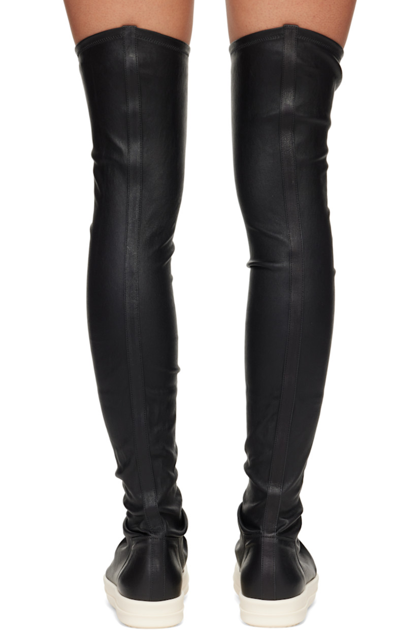 Knee-high stretch grained lambskin sneakers.

· Calfskin cap toe
· Draping at vamp
· Bonded jersey and buffed calfskin lining
· Treaded rubber sole

Supplier color: Black/Milk/Milk