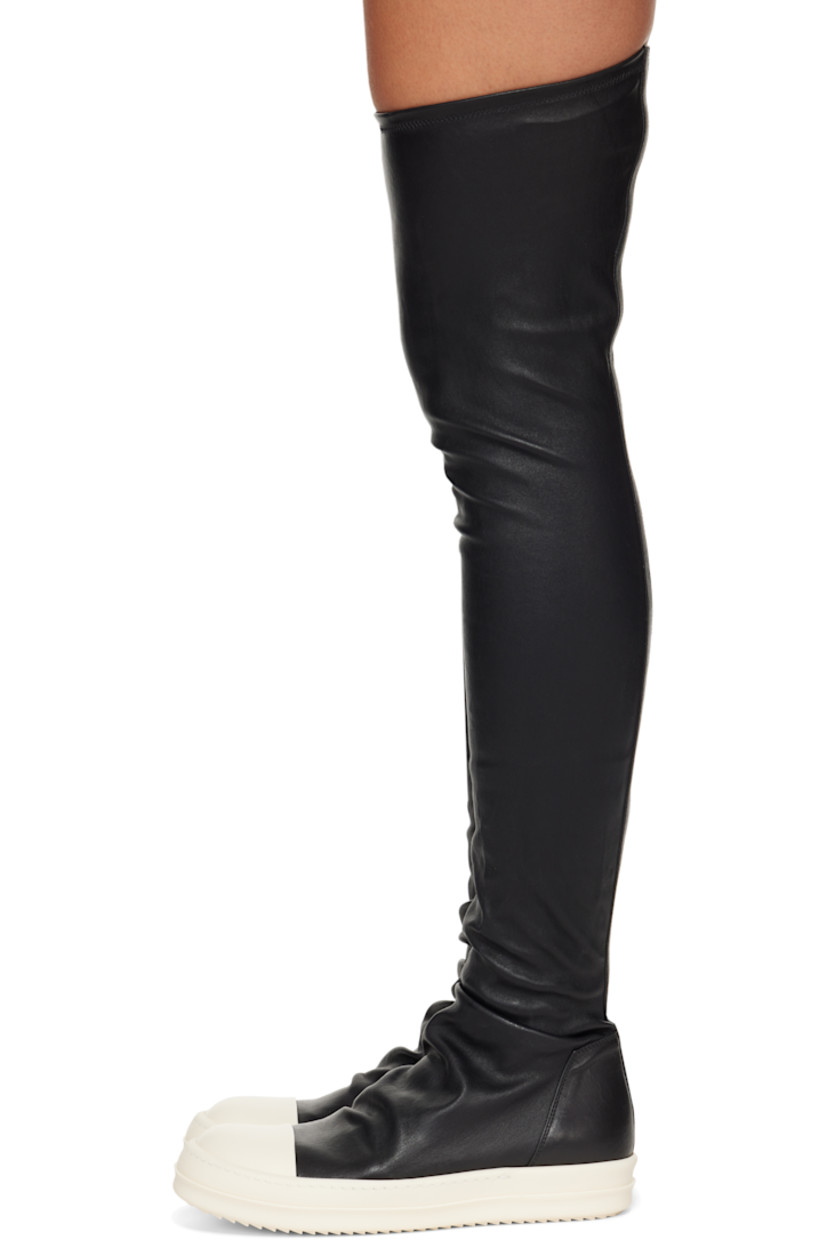 Knee-high stretch grained lambskin sneakers.

· Calfskin cap toe
· Draping at vamp
· Bonded jersey and buffed calfskin lining
· Treaded rubber sole

Supplier color: Black/Milk/Milk