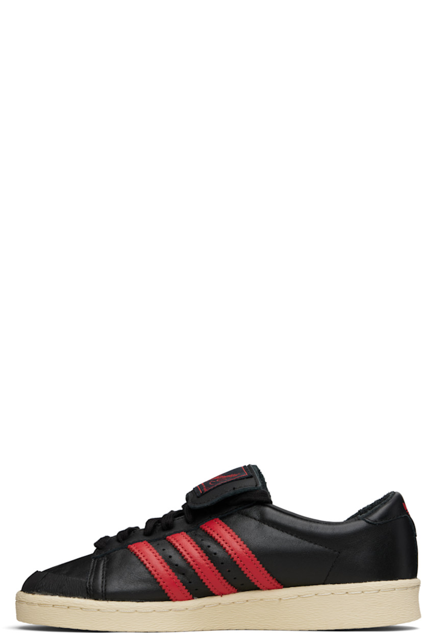 Buffed leather sneakers.

· Rubber cap toe
· Lace-up closure
· Logo patch at foldover tongue
· Padded collar
· Perforations and signature serrated stripes at sides
· Text stamp at outer side
· Leather lining
· Logo stamp at heel tab
· Rubber sole 

Part of the Willy Chavarria x adidas Originals collaboration.

Supplier color: Core black/Core black/Red
