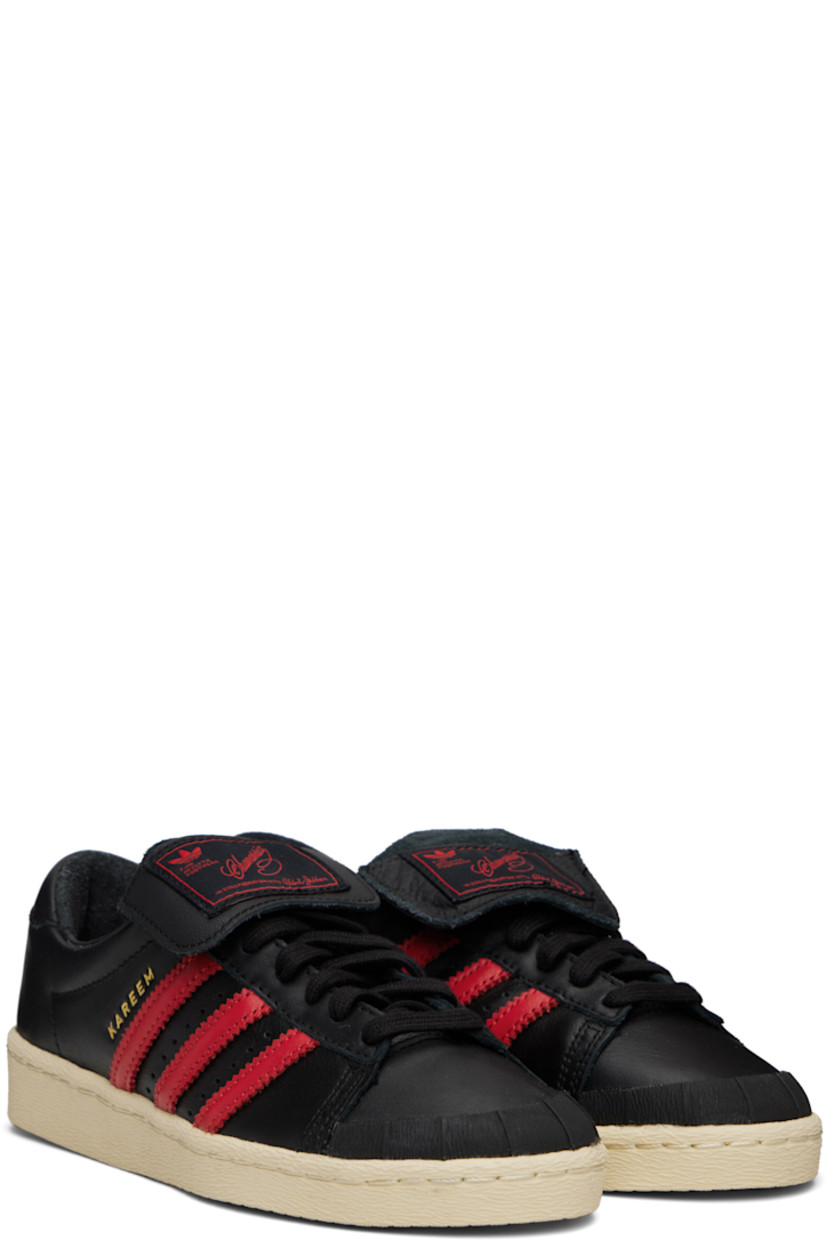 Buffed leather sneakers.

· Rubber cap toe
· Lace-up closure
· Logo patch at foldover tongue
· Padded collar
· Perforations and signature serrated stripes at sides
· Text stamp at outer side
· Leather lining
· Logo stamp at heel tab
· Rubber sole 

Part of the Willy Chavarria x adidas Originals collaboration.

Supplier color: Core black/Core black/Red