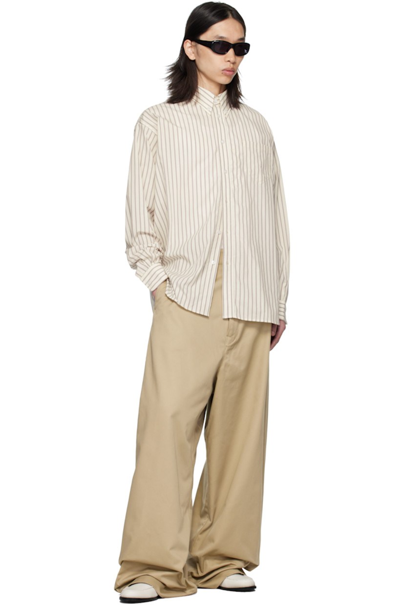Cotton poplin shirt. 

· Striped throughout 
· Buttoned-down spread collar 
· Button closure
· Patch pocket at chest
· Shirttail hem 
· Pleats at buttoned barrel cuffs
· Logo and inverted box pleat at back yoke 

Supplier color: Bordeau