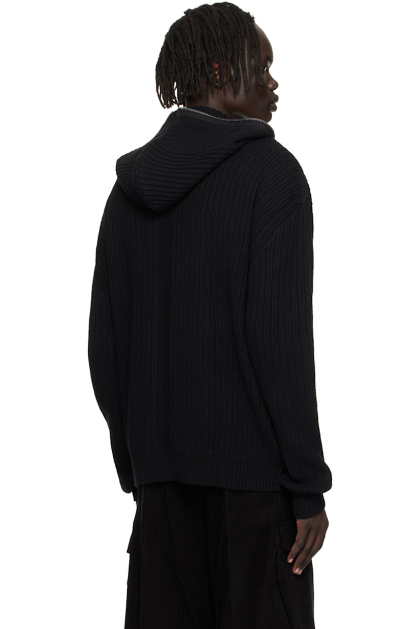 Heavyweight rib-knit virgin wool hoodie.

· Zip closure extends to hood
· Dropped shoulders
· Central garter-stitch stripe at back

Supplier color: Black