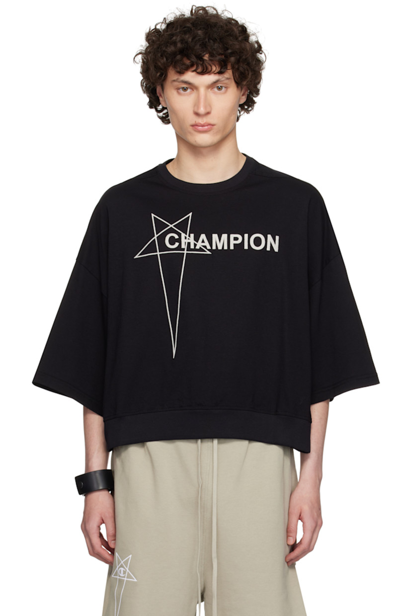 GOTS-certified organic cotton jersey T-shirt.

· Rib-knit crewneck and cropped hem
· Logo embroidered at front
· Offset shoulder seams
· Dropped shoulders
· Embroidered logo patch at cuff
· Central seam at back

Part of the Rick Owens x Champion collaboration.

Supplier color: Black