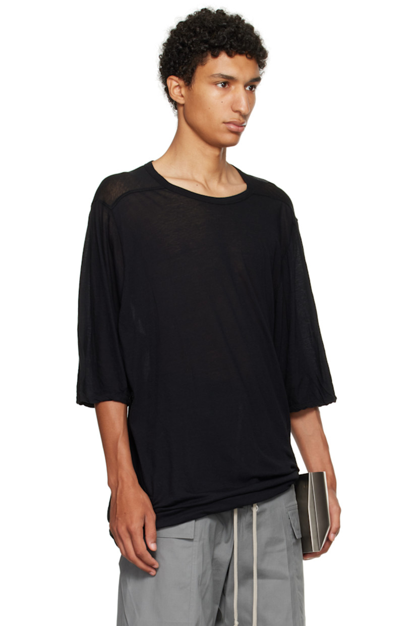Semi-sheer organic cotton jersey T-shirt.

· Oversized
· GOTS-certified organic cotton
· Rib-knit crewneck
· Twisted side seam
· Offset seam at shoulders

Supplier color: Black
