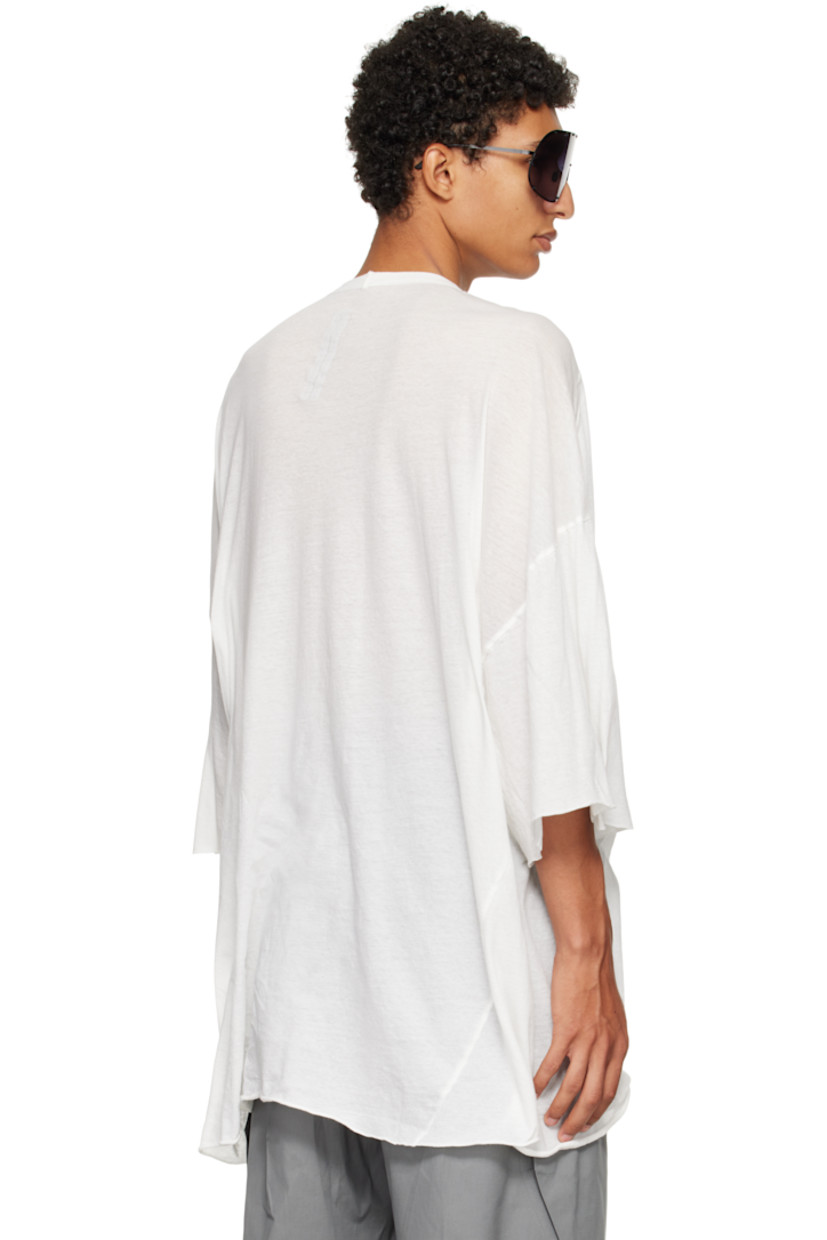 Semi-sheer organic cotton jersey T-shirt.

· GOTS-certified organic cotton
· Rib-knit crewneck
· Raw edge at hem and cuffs
· Twisted side seams
· Offset seam at dropped shoulders

Supplier color: Milk