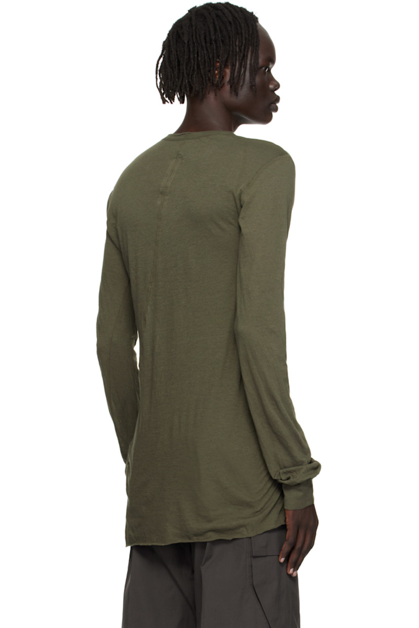 Semi-sheer organic cotton jersey T-shirt.

· GOTS-certified organic cotton
· Rib-knit crewneck and cuffs
· Raw edge at hem
· Twisted seam at side and back

Supplier color: Bosco