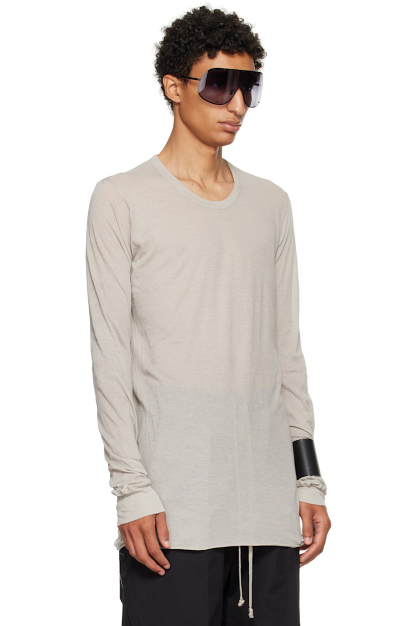 Semi-sheer organic cotton jersey T-shirt.

· GOTS-certified organic cotton
· Rib-knit crewneck and cuffs
· Raw edge at hem
· Twisted seam at side and back

Supplier color: Pearl