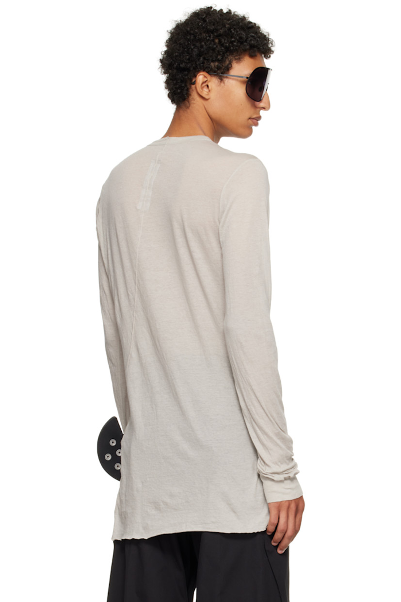 Semi-sheer organic cotton jersey T-shirt.

· GOTS-certified organic cotton
· Rib-knit crewneck and cuffs
· Raw edge at hem
· Twisted seam at side and back

Supplier color: Pearl
