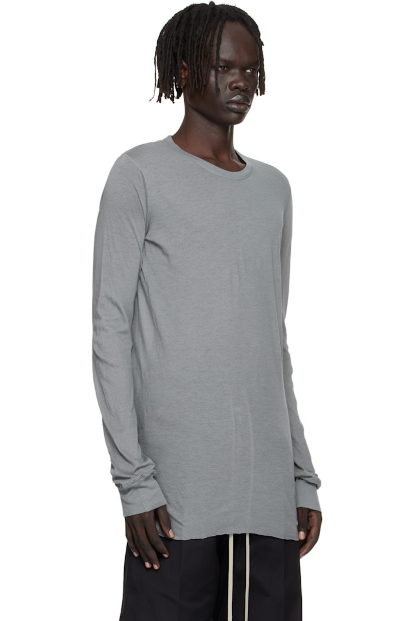 Semi-sheer organic cotton jersey T-shirt.

· GOTS-certified organic cotton
· Rib-knit crewneck and cuffs
· Raw edge at hem
· Twisted seam at side and back

Supplier color: Washed indigo