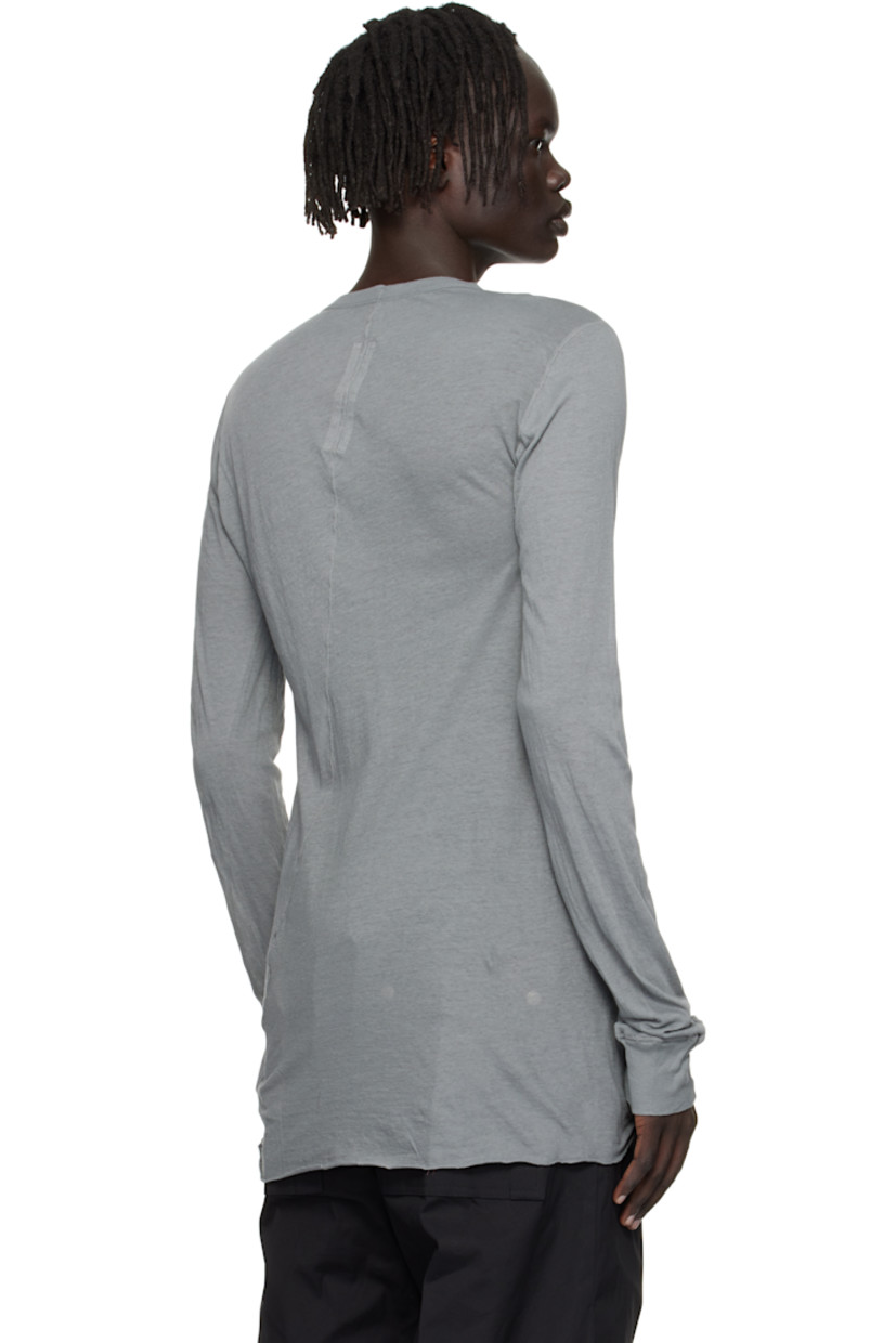 Semi-sheer organic cotton jersey T-shirt.

· GOTS-certified organic cotton
· Rib-knit crewneck and cuffs
· Raw edge at hem
· Twisted seam at side and back

Supplier color: Washed indigo
