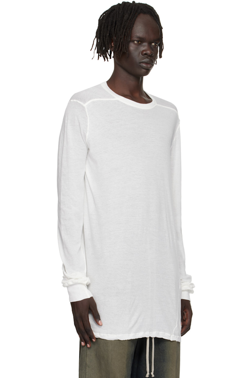 Semi-sheer organic cotton jersey T-shirt.

· GOTS-certified organic cotton
· Rib-knit crewneck and cuffs
· Twisted side seams
· Offset seam at shoulders

Supplier color: Milk