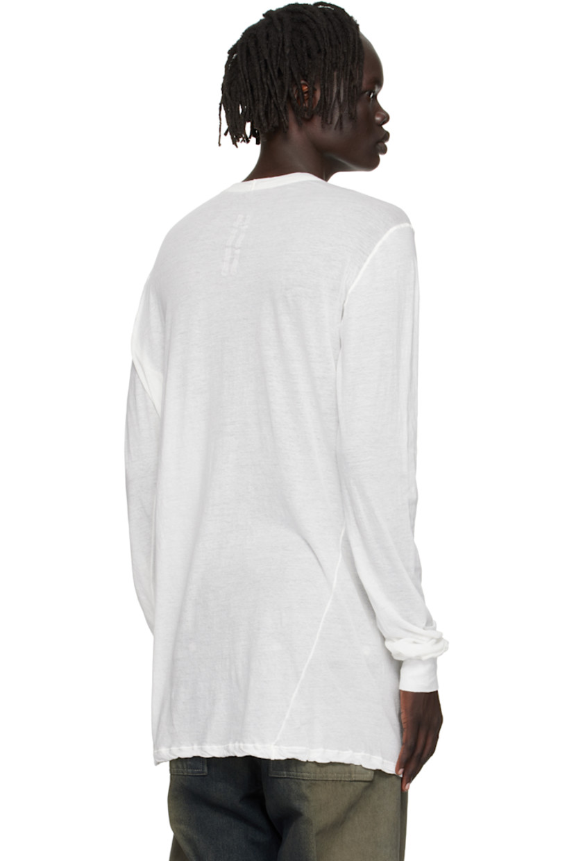 Semi-sheer organic cotton jersey T-shirt.

· GOTS-certified organic cotton
· Rib-knit crewneck and cuffs
· Twisted side seams
· Offset seam at shoulders

Supplier color: Milk