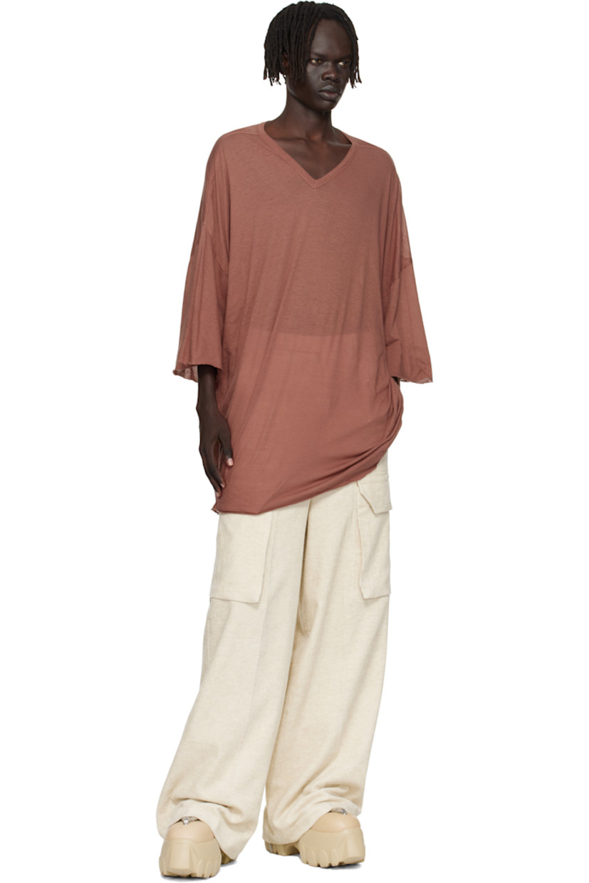 Semi-sheer organic cotton jersey T-shirt.

· GOTS-certified organic cotton
· Rib-knit V-neck
· Raw edge at hem and cuffs
· Twisted side seams
· Offset seam at dropped shoulders

Supplier color: Dark pink