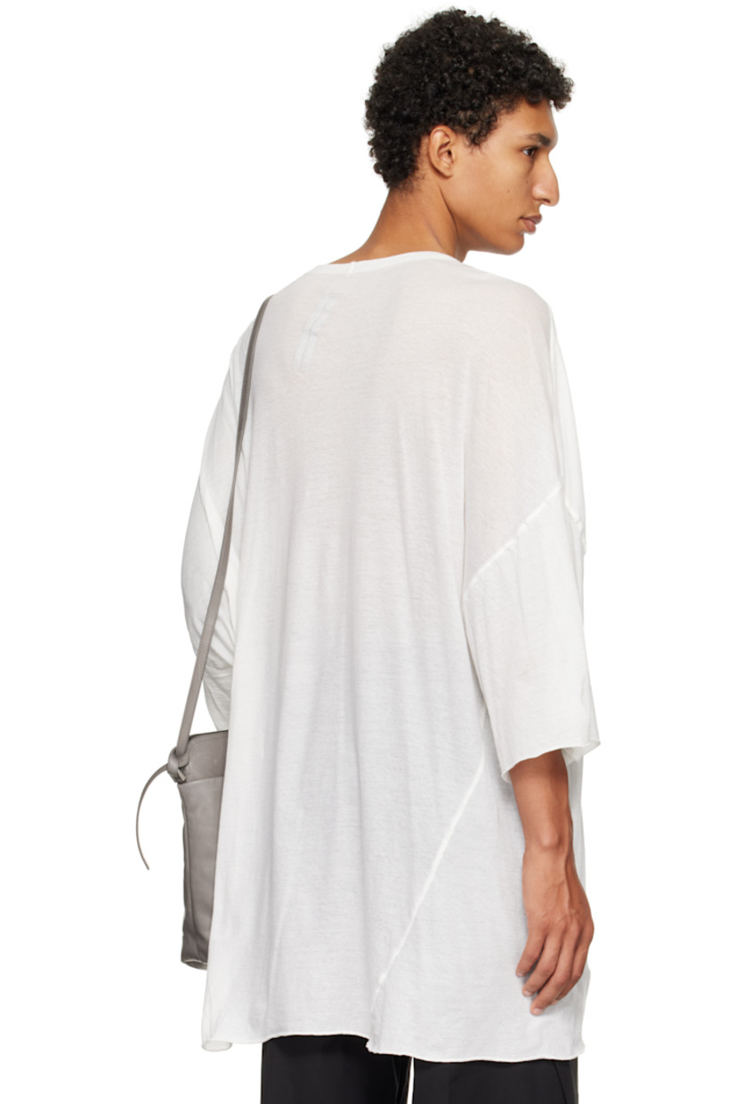 Semi-sheer organic cotton jersey T-shirt.

· GOTS-certified organic cotton
· Rib-knit V-neck
· Raw edge at hem and cuffs
· Twisted side seams
· Offset seam at dropped shoulders

Supplier color: Milk