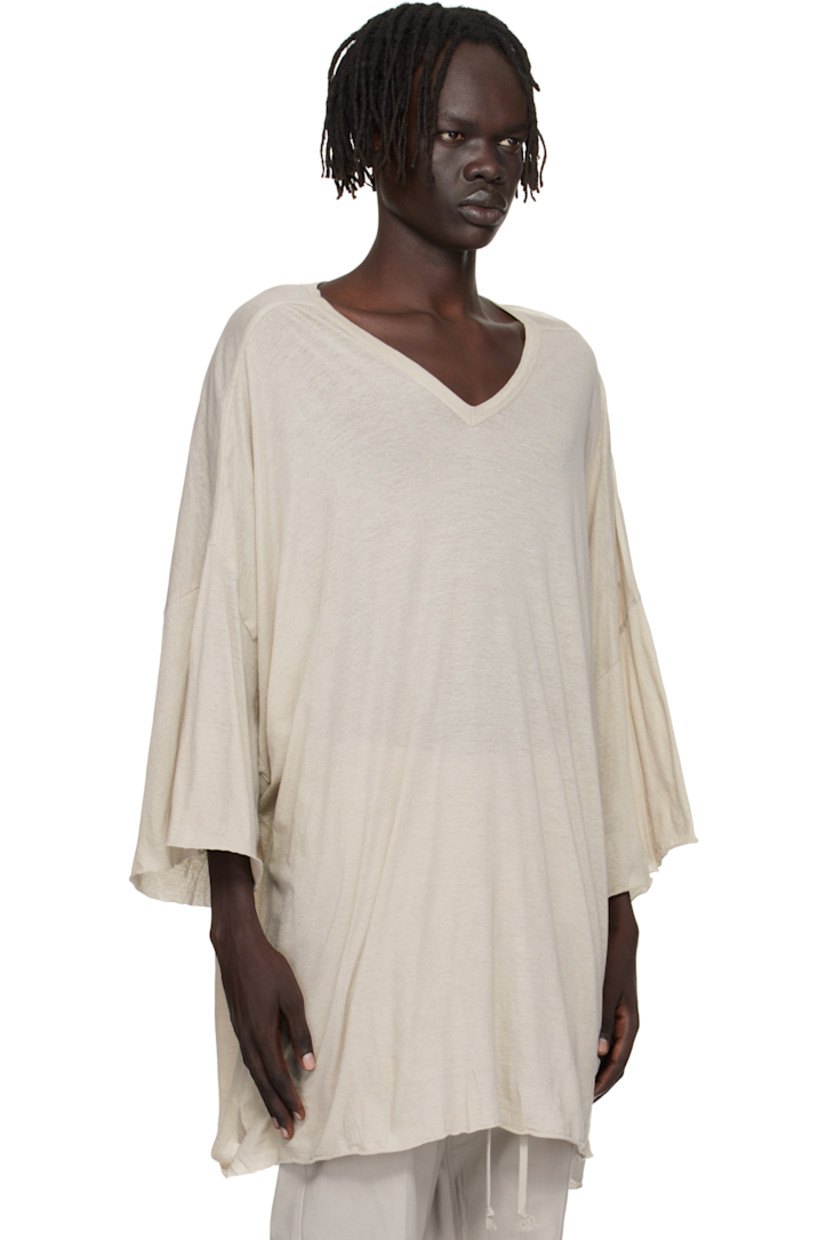 Semi-sheer organic cotton jersey T-shirt.

· GOTS-certified organic cotton
· Rib-knit V-neck
· Raw edge at hem and cuffs
· Twisted side seams
· Offset seam at dropped shoulders

Supplier color: Pearl