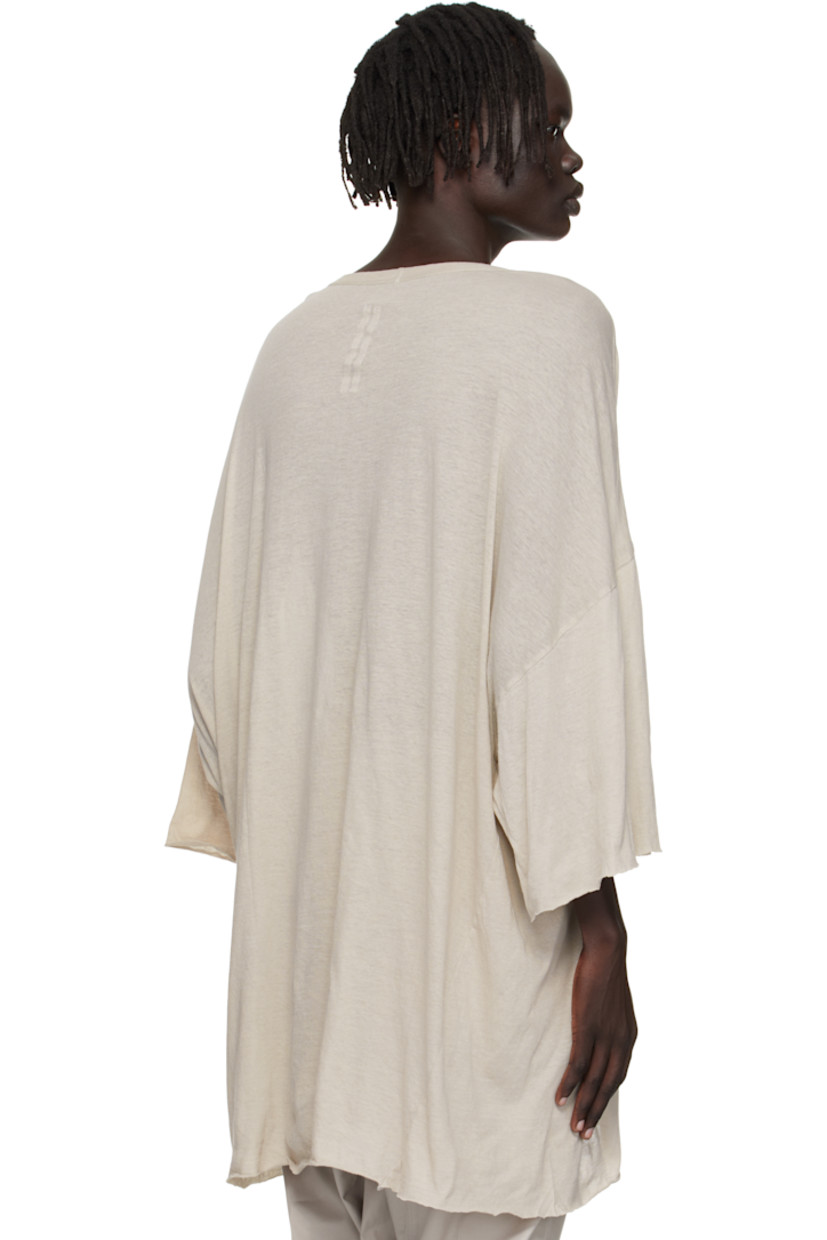 Semi-sheer organic cotton jersey T-shirt.

· GOTS-certified organic cotton
· Rib-knit V-neck
· Raw edge at hem and cuffs
· Twisted side seams
· Offset seam at dropped shoulders

Supplier color: Pearl