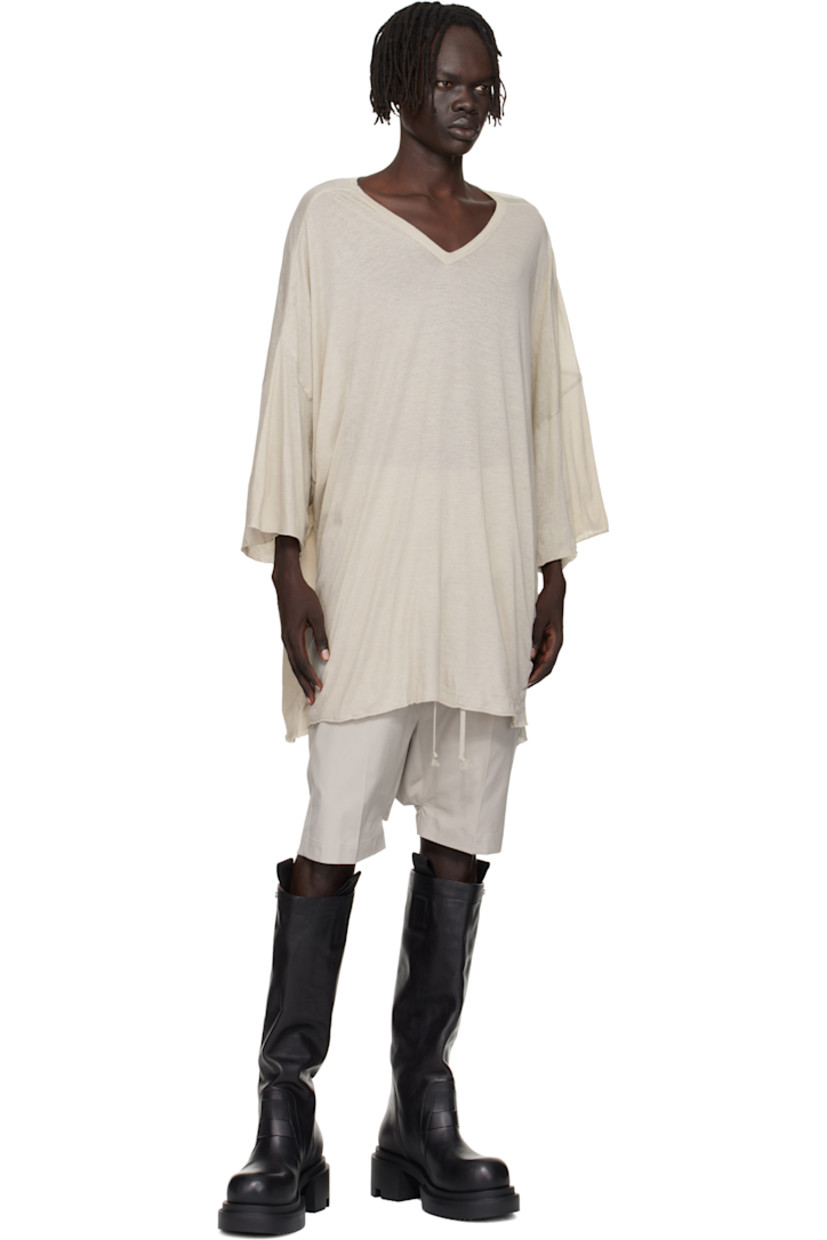 Semi-sheer organic cotton jersey T-shirt.

· GOTS-certified organic cotton
· Rib-knit V-neck
· Raw edge at hem and cuffs
· Twisted side seams
· Offset seam at dropped shoulders

Supplier color: Pearl