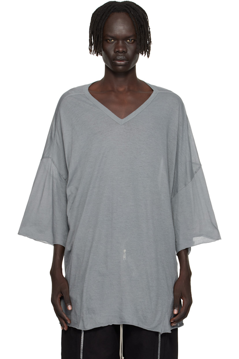 Semi-sheer organic cotton jersey T-shirt.

· GOTS-certified organic cotton
· Rib-knit V-neck
· Raw edge at hem and cuffs
· Twisted side seams
· Offset seam at dropped shoulders

Supplier color: Washed indigo
