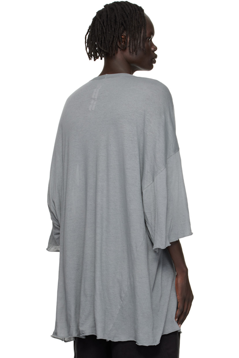 Semi-sheer organic cotton jersey T-shirt.

· GOTS-certified organic cotton
· Rib-knit V-neck
· Raw edge at hem and cuffs
· Twisted side seams
· Offset seam at dropped shoulders

Supplier color: Washed indigo