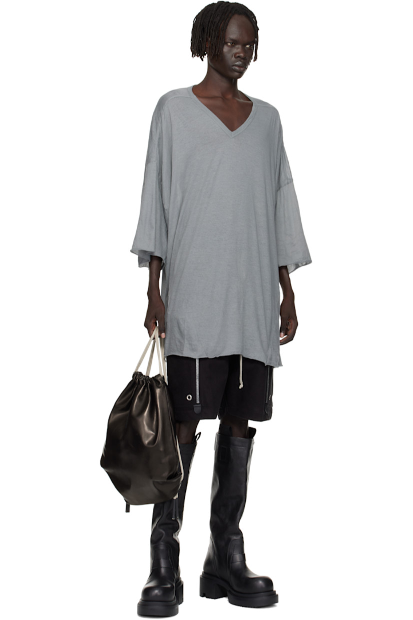 Semi-sheer organic cotton jersey T-shirt.

· GOTS-certified organic cotton
· Rib-knit V-neck
· Raw edge at hem and cuffs
· Twisted side seams
· Offset seam at dropped shoulders

Supplier color: Washed indigo