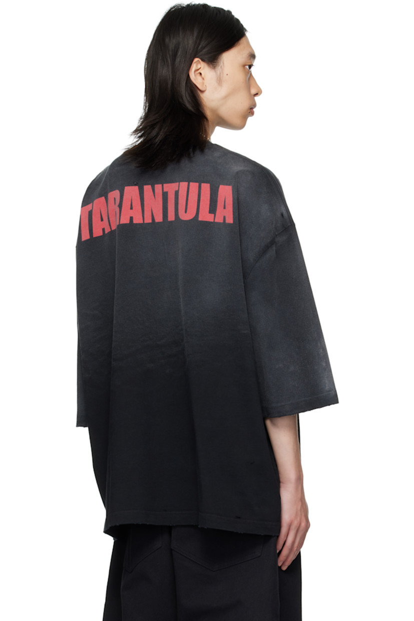 Cotton jersey T-shirt. 

· Fading and subtle distressing throughout 
· Rib-knit crewneck
· Graphic printed at front 
· Dropped shoulders
· Text printed at back

Supplier color: Black