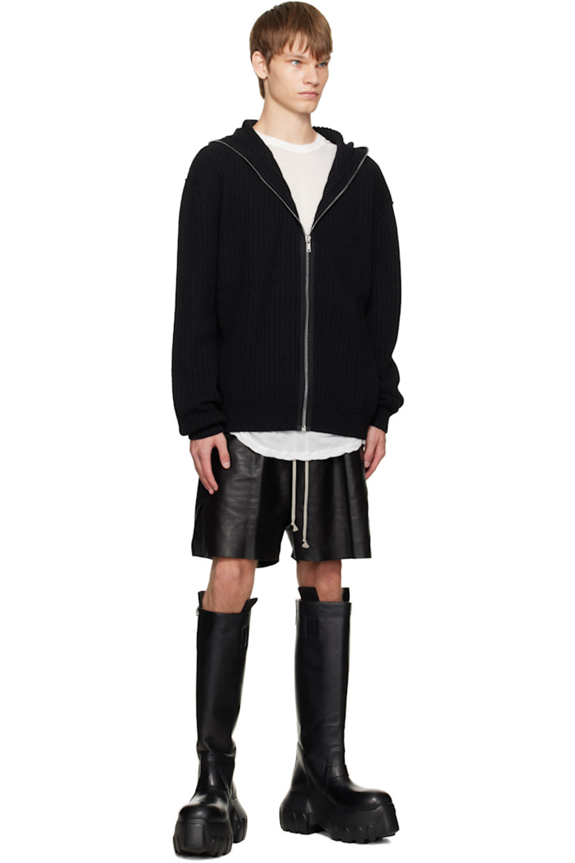 Knee-high vegetable-tanned grained calfskin boots.

· LWG-certified calfskin
· Pull-loops and adjustable press-stud tab at collar
· Calfskin suede lining
· Treaded rubber platform sole
· Platform: H3"

Supplier color: Black