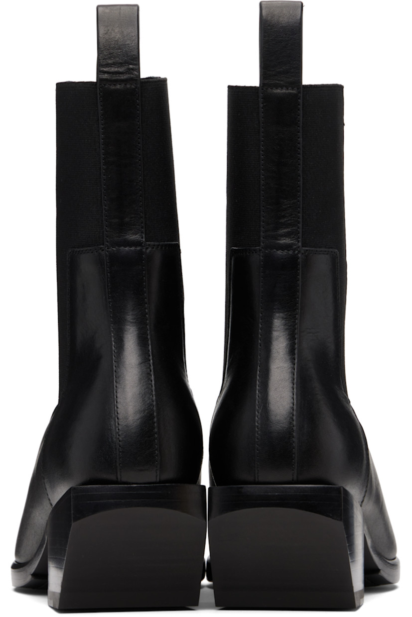 Ankle-high buffed leather Chelsea boots.

· Square toe
· Elasticized gusset at sides
· Pull-loop at heel collar
· Stacked leather heel with rubber injection
· Leather sole
· Heel: H2"

Supplier color: Black/Black