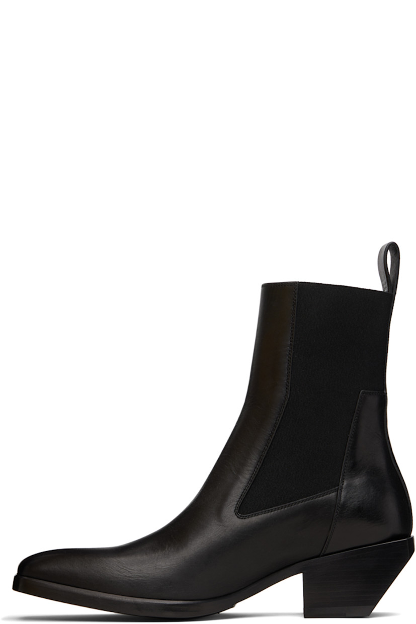 Ankle-high buffed leather Chelsea boots.

· Square toe
· Elasticized gusset at sides
· Pull-loop at heel collar
· Stacked leather heel with rubber injection
· Leather sole
· Heel: H2"

Supplier color: Black/Black