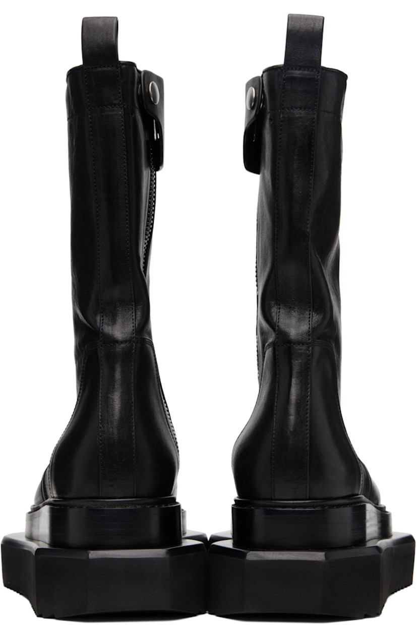 Mid-calf buffed leather boots.

· Zip closure and press-stud tab at inner side
· Pull-loop at heel collar
· Stacked leather and foam rubber platform midsole
· Treaded rubber sole
· Platform: H2.5"

Supplier color: Black
