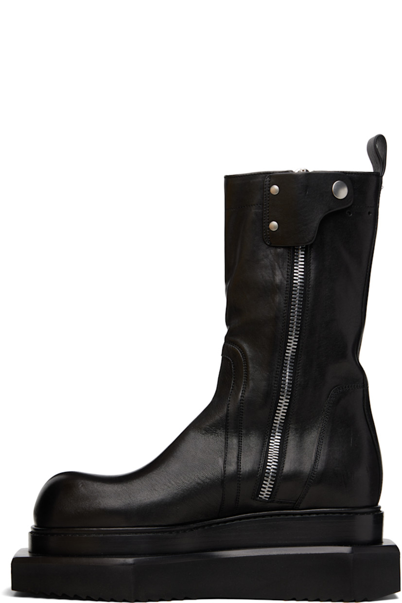 Mid-calf buffed leather boots.

· Zip closure and press-stud tab at inner side
· Pull-loop at heel collar
· Stacked leather and foam rubber platform midsole
· Treaded rubber sole
· Platform: H2.5"

Supplier color: Black