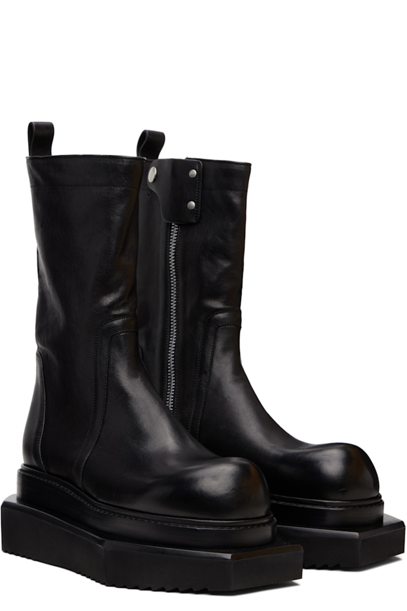 Mid-calf buffed leather boots.

· Zip closure and press-stud tab at inner side
· Pull-loop at heel collar
· Stacked leather and foam rubber platform midsole
· Treaded rubber sole
· Platform: H2.5"

Supplier color: Black