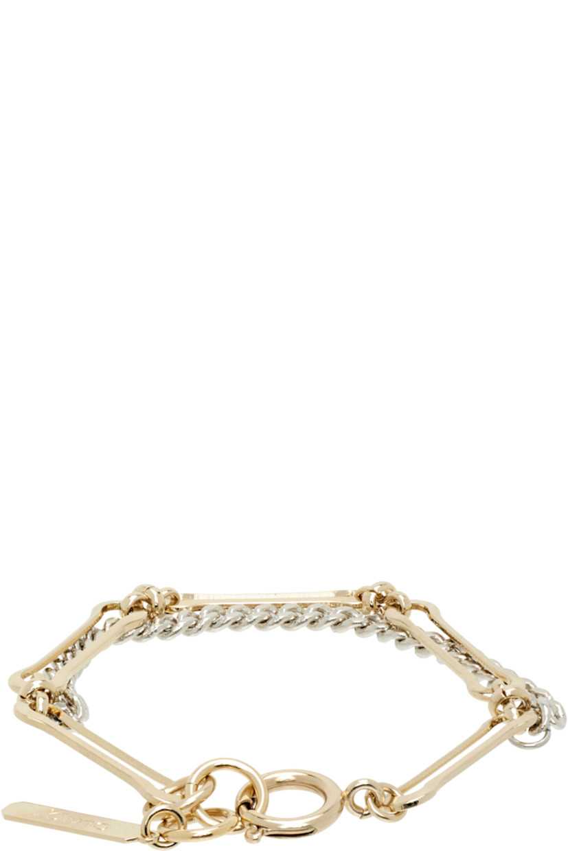 Handcrafted tiered cable chain and curb chain bracelet in 24k yellow gold- and palladium-plated brass.

· Logo plaque at adjustable spring-ring fastening
· L7"

Supplier color: Gold/Silver