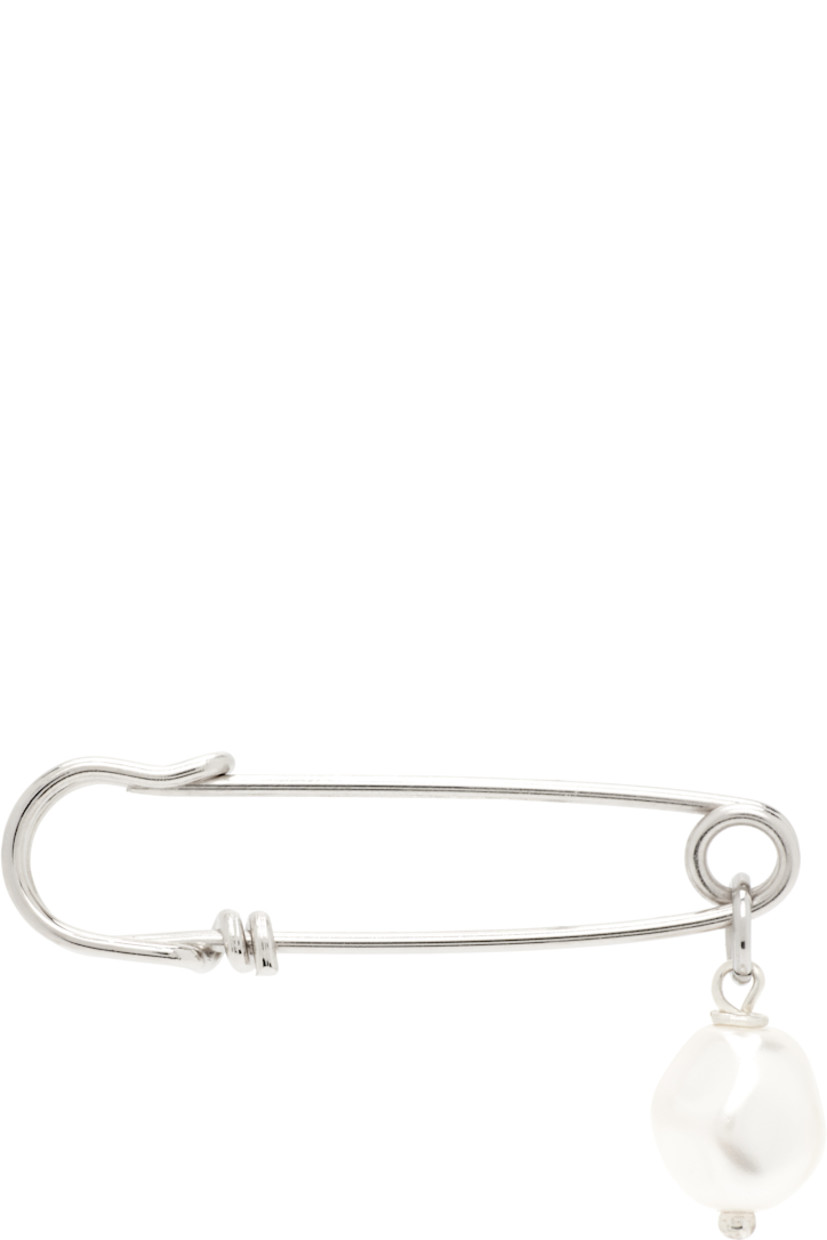 Single handcrafted drop earring in palladium-plated brass.

· Faux-pearl pendant at drop
· Safety-pin fastening
· H2" x W0.5"

Supplier color: Palladium