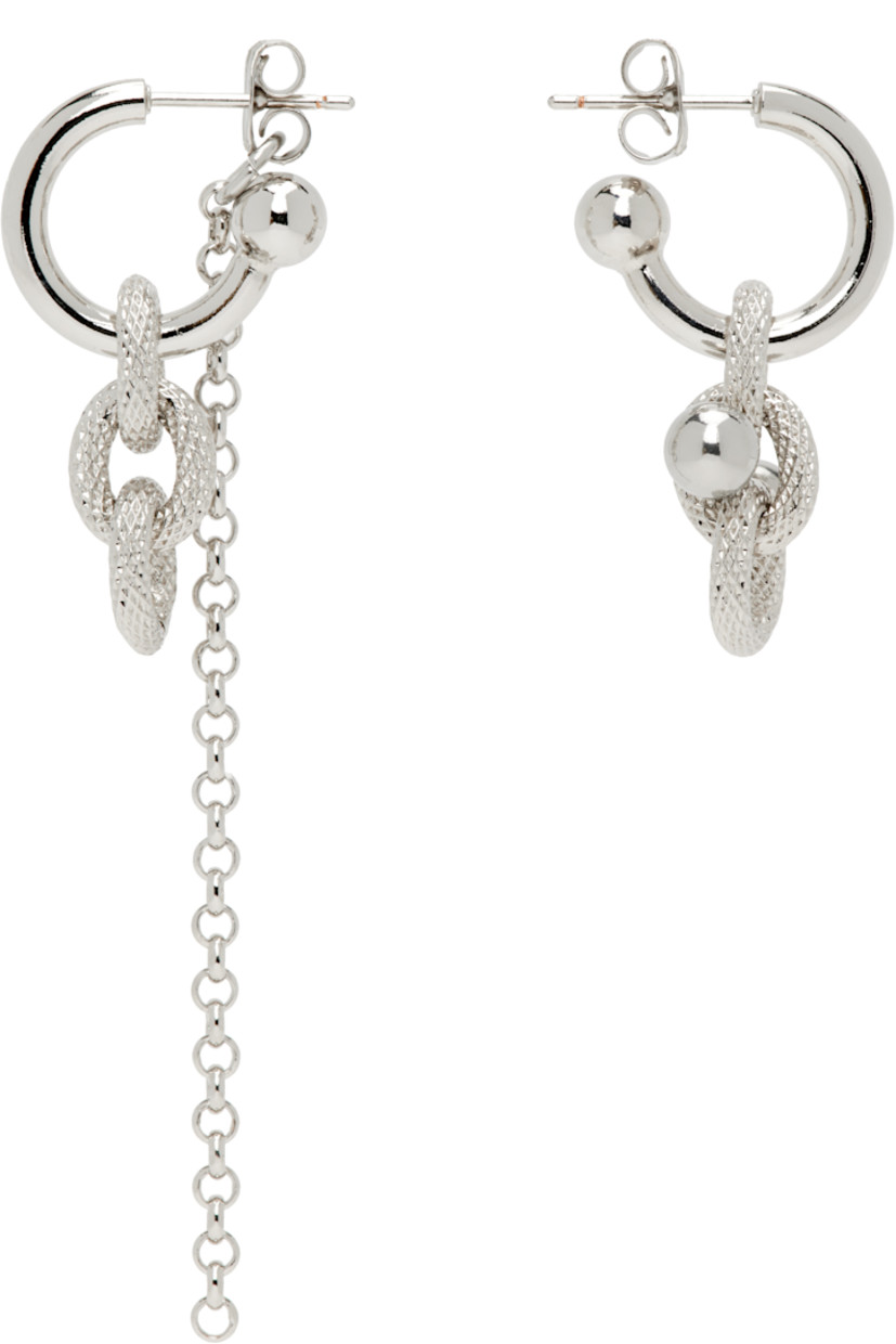 Pair of handcrafted mismatched drop earrings in palladium-plated brass.

· Charms at drop
· Rolo chain at single drop
· Post-stud fastening
· H2.25" x W0.5"; H1" x W0.5"

Supplier color: Palladium