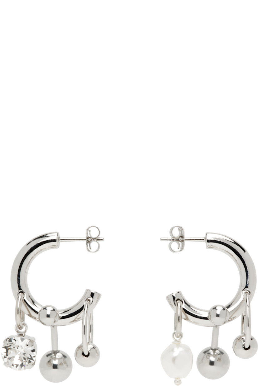 Pair of handcrafted mismatched open hoop earrings in palladium-plated brass.

· Charms, crystal, and faux-pearl at drop
· Post-stud fastening 
· H1" x W0.5"; H1" x W0.5"

Available exclusively at SSENSE.

Supplier color: Crystal