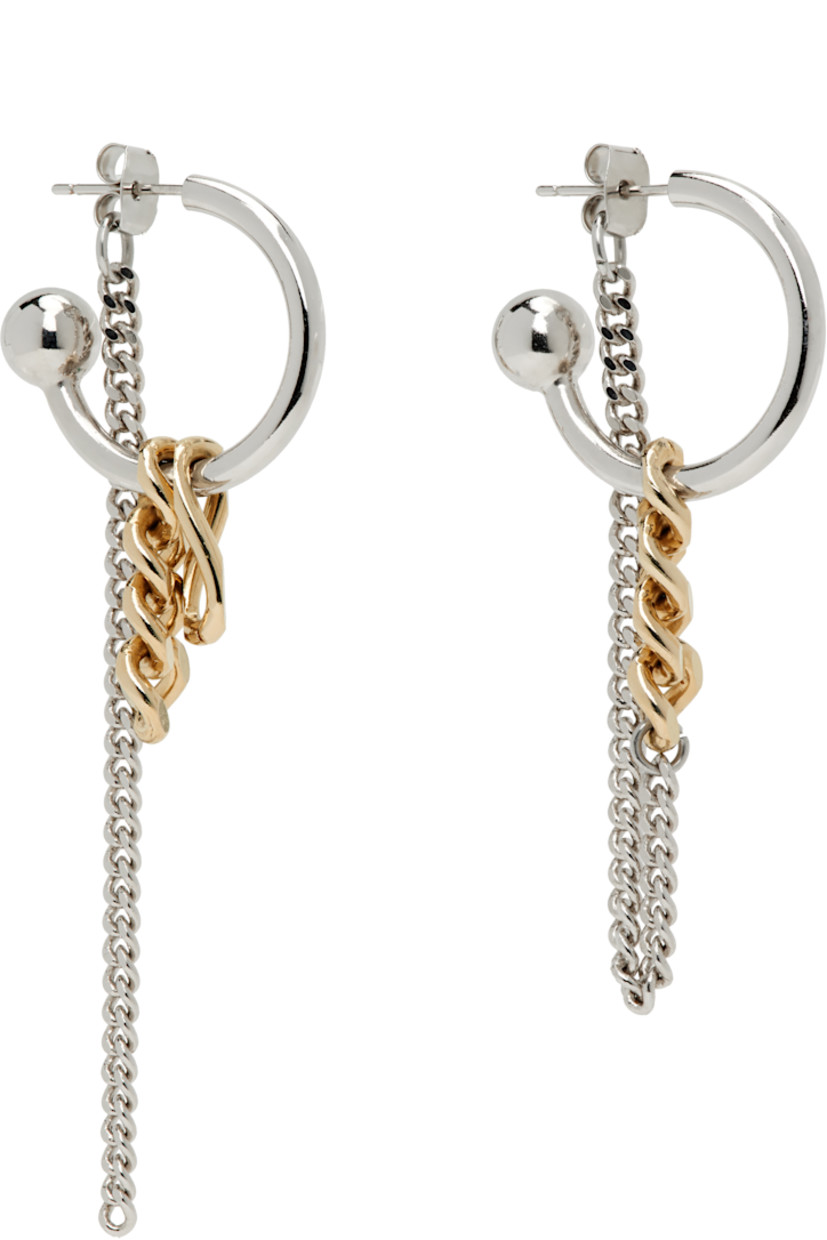 Pair of handcrafted mismatched drop earrings in 24k gold- and palladium-plated brass.

· Charms and curb chain at drop 
· Post-stud fastening 
· H3" x W1"; H2" x W1"

Supplier color: Gold/Palladium