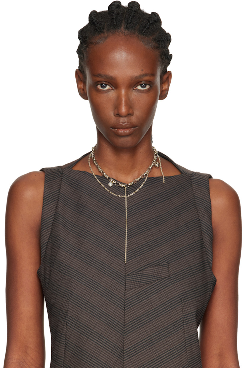 Handcrafted tiered cable chain necklace in 24k yellow gold-plated brass.

· Faux-pearl and charms at length
· Chain detailing at drop
· Logo plaque at spring-ring fastening
· L15"

Available exclusively at SSENSE.

Supplier color: Gold